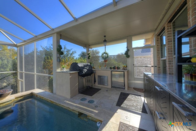 exterior space with area for grilling, a lanai, and a patio