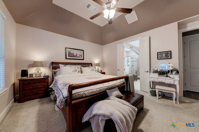 carpeted bedroom featuring vaulted ceiling and ceiling fan