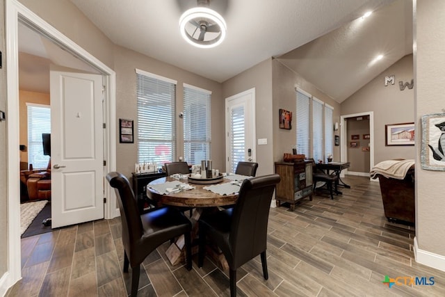 dining area with lofted ceiling