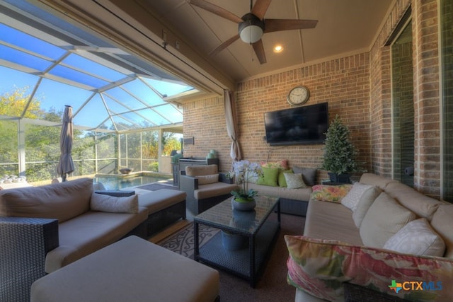 view of patio / terrace featuring outdoor lounge area, a jacuzzi, and a lanai