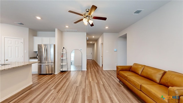 1519 Merritt St, Temple, TX 76504 - living room featuring light wood-style flooring, ceiling fan, recessed lighting, and baseboards