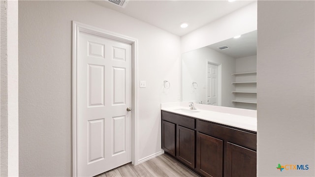 1519 Merritt St, Temple, TX 76504 - bathroom featuring wood finished floors and vanity
