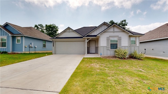 1519 Merritt St, Temple, TX 76504 - view of front of property with board and batten siding, a garage, concrete driveway, and a front lawn