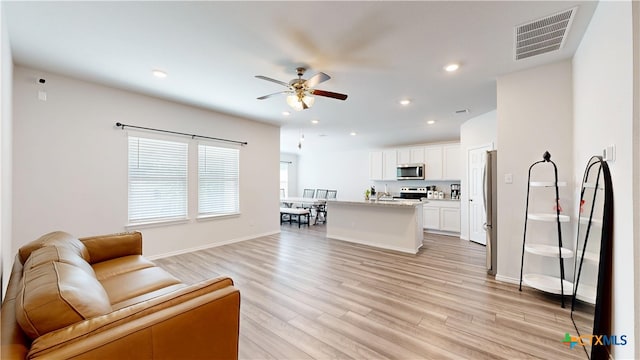 1519 Merritt St, Temple, TX 76504 - living room featuring a ceiling fan, light wood-type flooring, recessed lighting, and baseboards