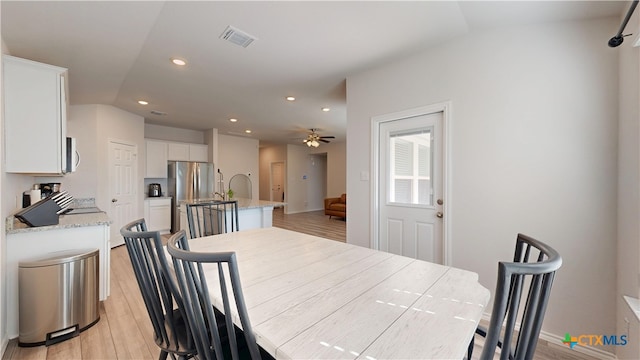 1519 Merritt St, Temple, TX 76504 - dining area featuring light wood-style flooring, ceiling fan, recessed lighting, vaulted ceiling, and baseboards