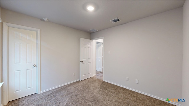 1519 Merritt St, Temple, TX 76504 - unfurnished bedroom featuring carpet and baseboards