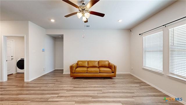 1519 Merritt St, Temple, TX 76504 - sitting room featuring washer / dryer, ceiling fan, light wood-type flooring, recessed lighting, and baseboards