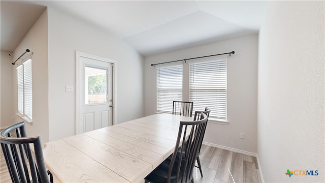 1519 Merritt St, Temple, TX 76504 - dining area with plenty of natural light, light wood-type flooring, vaulted ceiling, and baseboards