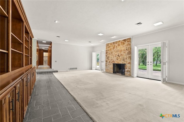517 Cherokee Dr, Temple, TX 76504 - unfurnished living room featuring visible vents, a wealth of natural light, and ornamental molding