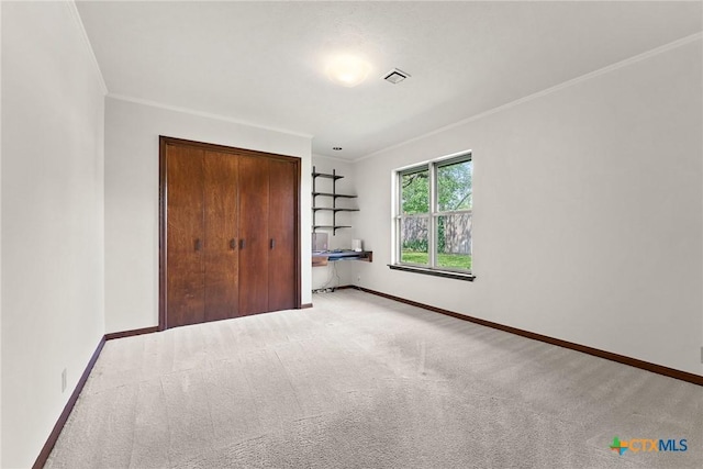 517 Cherokee Dr, Temple, TX 76504 - unfurnished bedroom with carpet floors, ornamental molding, visible vents, and a closet