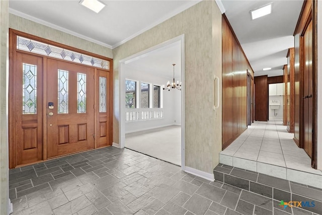 517 Cherokee Dr, Temple, TX 76504 - entryway with stone tile flooring, ornamental molding, baseboards, and a notable chandelier