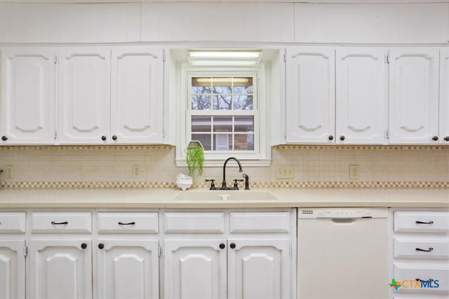 kitchen with dishwasher, sink, and white cabinets