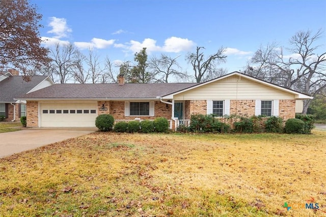 single story home with a garage and a front yard