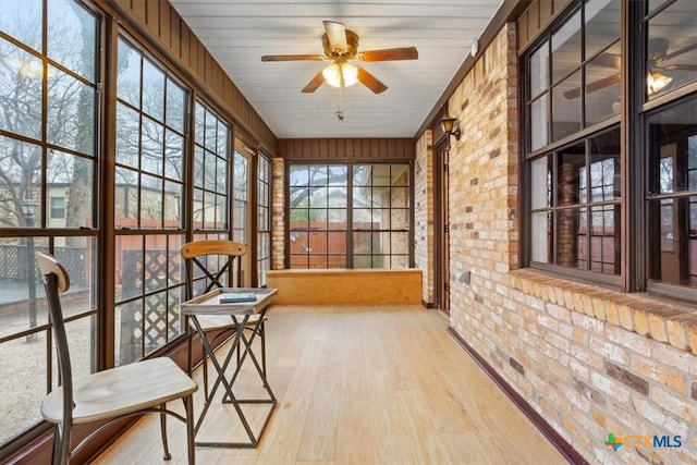 sunroom / solarium with ceiling fan