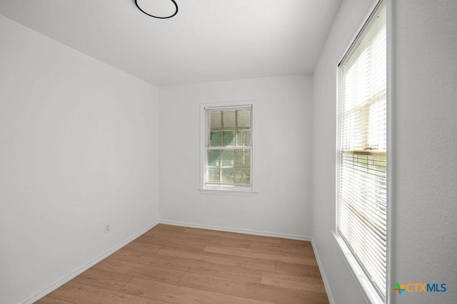 1408 Mulford St, Killeen, TX 76541 - empty room featuring light wood-style floors and baseboards
