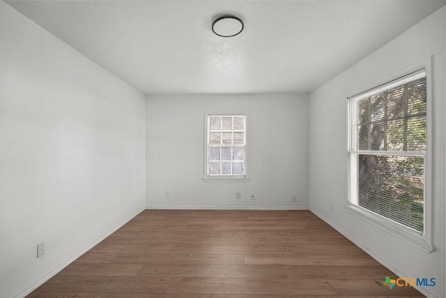 1408 Mulford St, Killeen, TX 76541 - unfurnished room featuring wood finished floors and baseboards