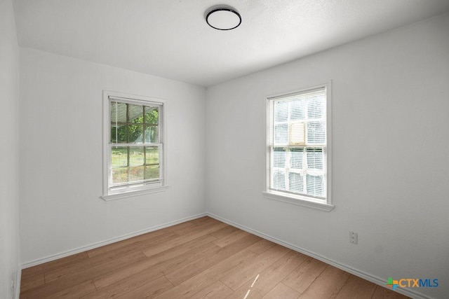 1408 Mulford St, Killeen, TX 76541 - spare room featuring light wood-style floors and baseboards