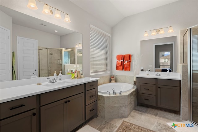 bathroom with vanity, plus walk in shower, and vaulted ceiling