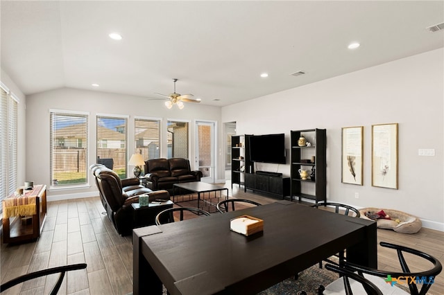 dining area featuring ceiling fan and lofted ceiling