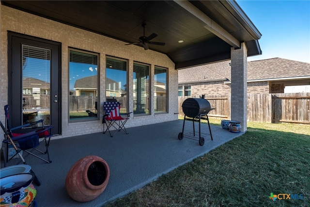 view of patio / terrace featuring ceiling fan and a grill