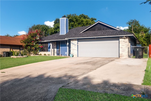 single story home with a garage and a front yard