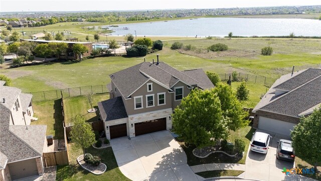 view of yard featuring a fenced backyard and a water view