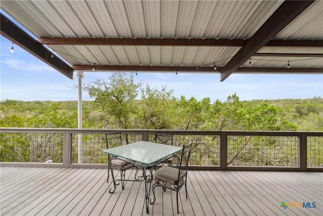 deck with a wooded view