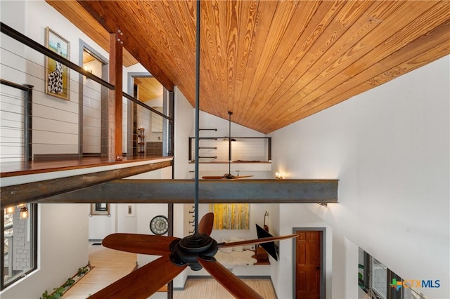 staircase with wood ceiling, vaulted ceiling, and wood finished floors