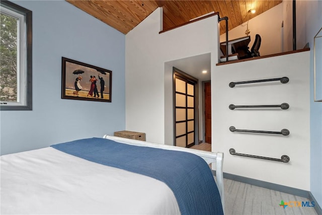 bedroom with lofted ceiling, wooden ceiling, light wood-style flooring, and baseboards