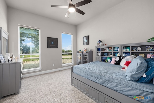 bedroom featuring ceiling fan and light colored carpet