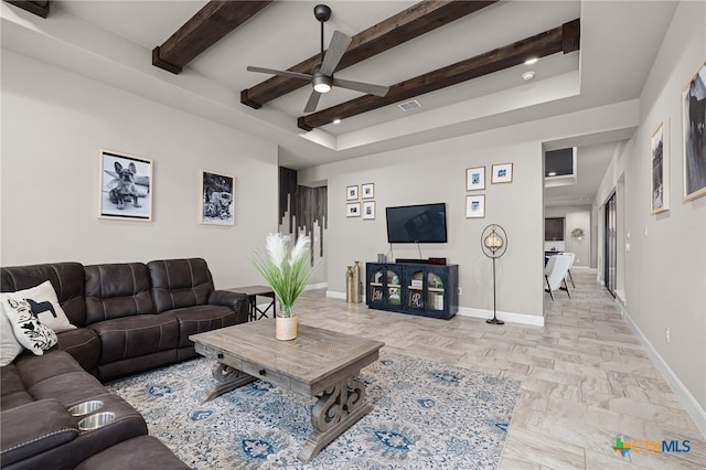 living room with ceiling fan and beam ceiling