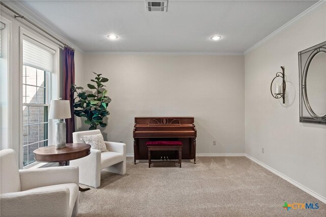 sitting room with carpet, crown molding, recessed lighting, visible vents, and baseboards