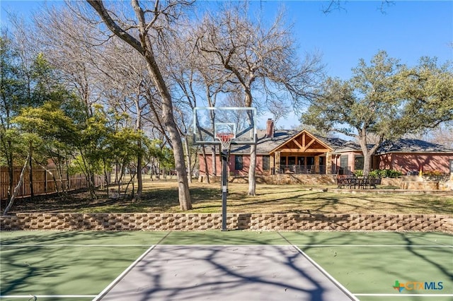 view of sport court with community basketball court and fence