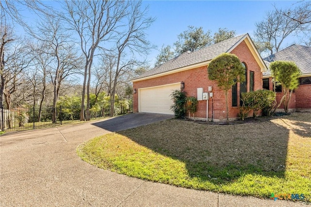 view of property exterior featuring driveway, a garage, fence, a yard, and brick siding