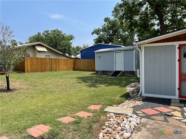 201 Sycamore, Tow, TX 78672 - view of yard featuring a storage shed and an outbuilding