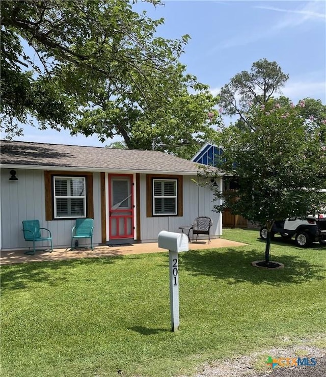 201 Sycamore, Tow, TX 78672 - ranch-style house with a front lawn and a shingled roof