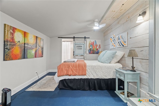201 Sycamore, Tow, TX 78672 - bedroom featuring lofted ceiling, a barn door, concrete flooring, baseboards, and ceiling fan