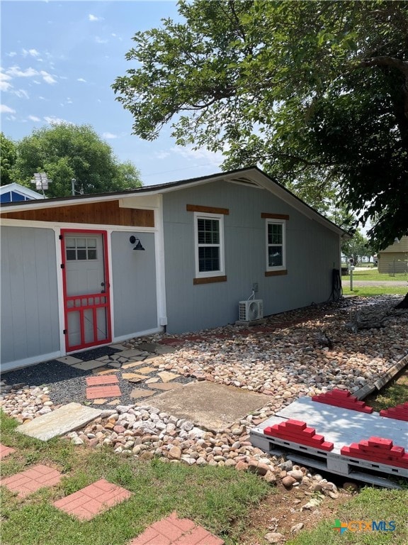 201 Sycamore, Tow, TX 78672 - back of property featuring a cooling unit