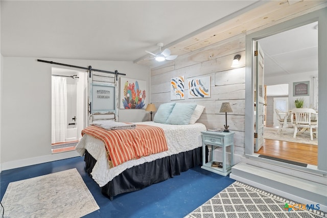 201 Sycamore, Tow, TX 78672 - bedroom featuring a barn door, lofted ceiling, baseboards, and a ceiling fan