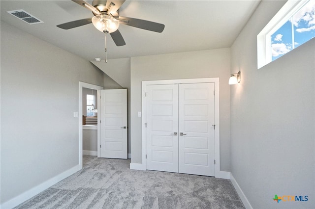 unfurnished bedroom featuring baseboards, visible vents, and a closet