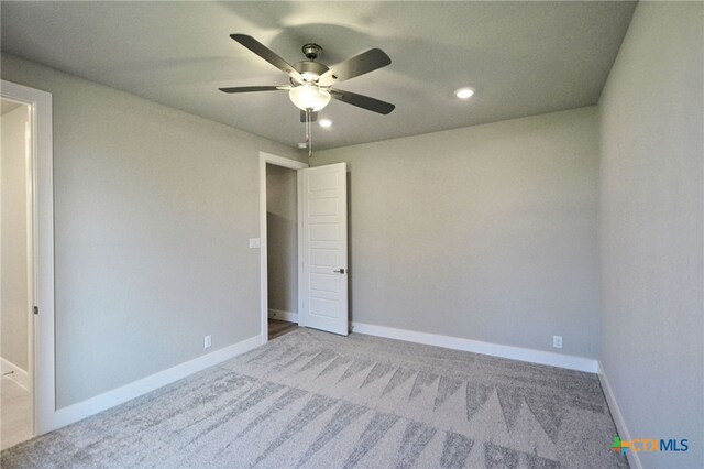 unfurnished bedroom with recessed lighting, baseboards, carpet, and a ceiling fan