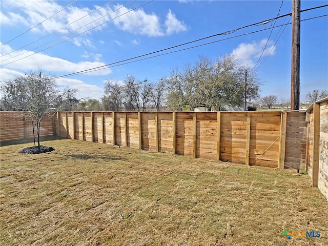 view of yard featuring a fenced backyard