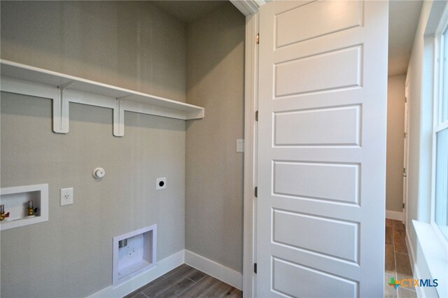 laundry area with dark wood-style floors, baseboards, gas dryer hookup, hookup for an electric dryer, and washer hookup