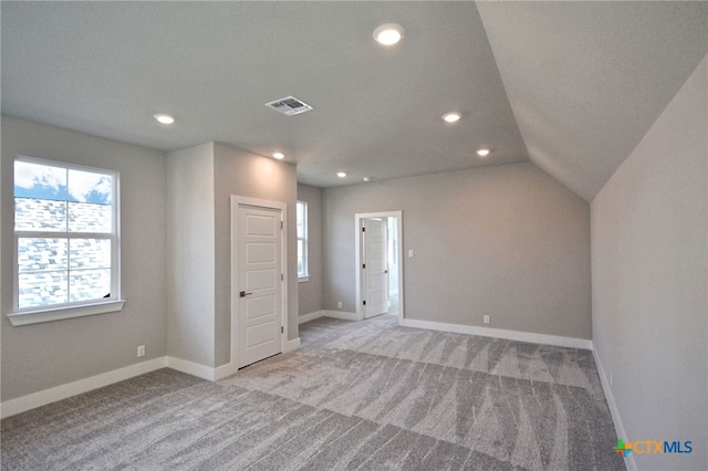 interior space with carpet, visible vents, and baseboards