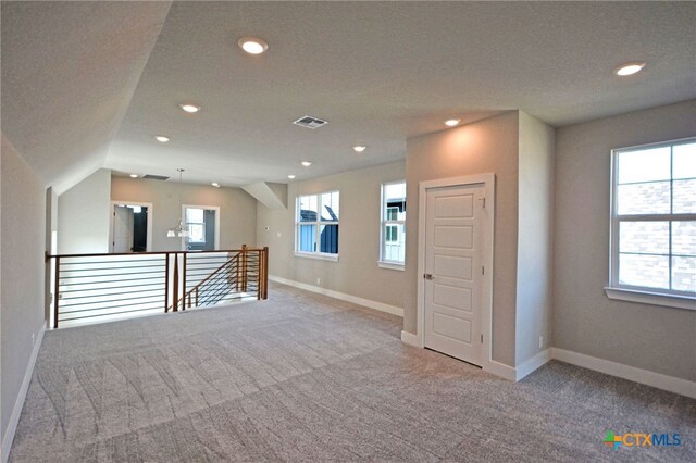 empty room with carpet flooring, recessed lighting, and baseboards