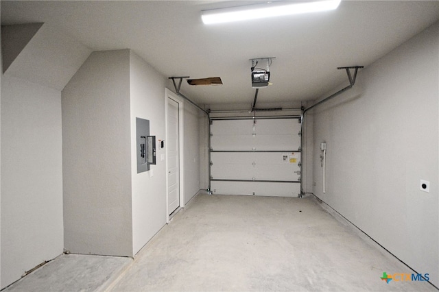 garage featuring electric panel and a garage door opener