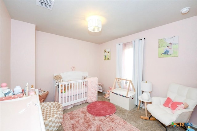 620 Saxon St, Seguin, TX 78155 - bedroom featuring carpet and a crib