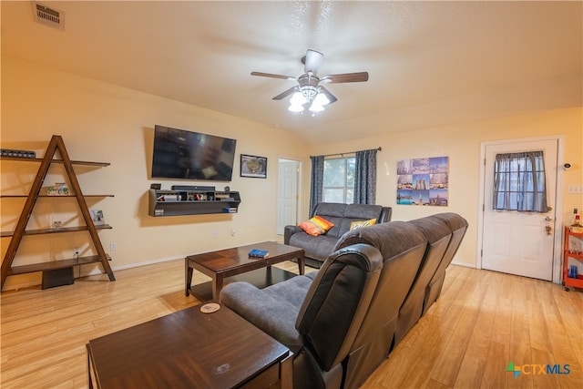 living room with light hardwood / wood-style floors, ceiling fan, and lofted ceiling