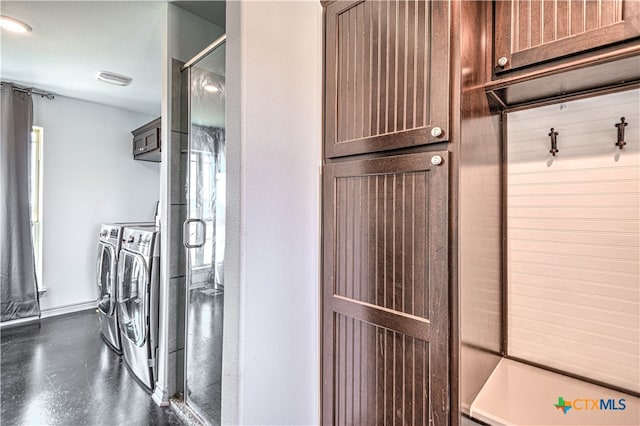 interior space with concrete floors and separate washer and dryer