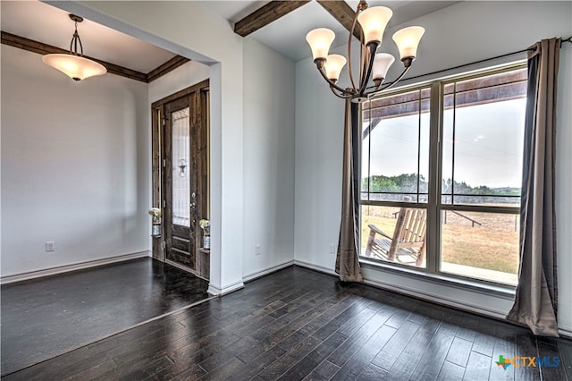 interior space featuring dark hardwood / wood-style floors, beam ceiling, an inviting chandelier, and ornamental molding